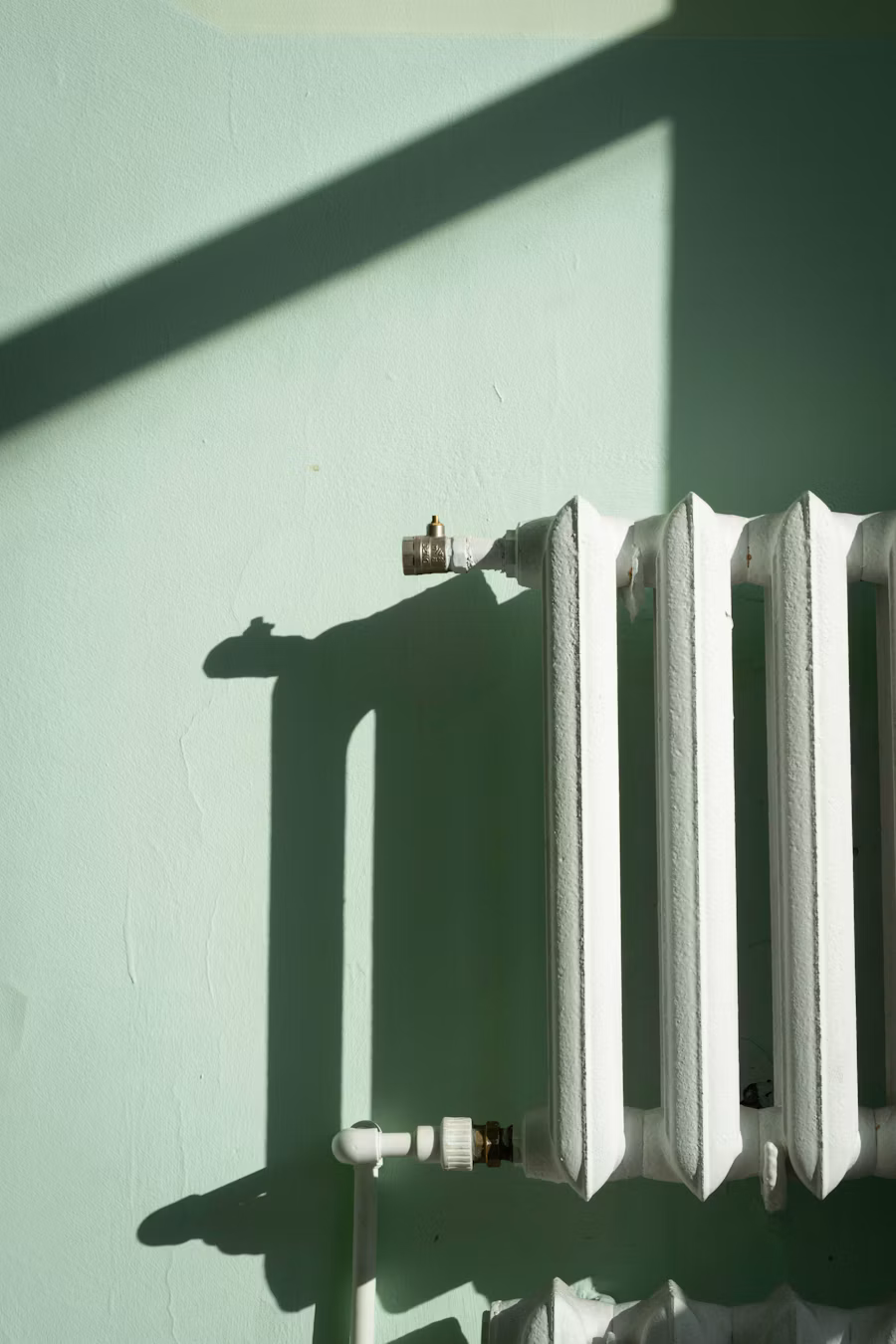 White radiator against a softly lit wall